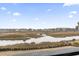 Breathtaking marsh view showcasing the serene landscape and natural beauty of this property at 123 N Dogwood St. # 107, Garden City Beach, SC 29576