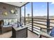 Charming screened patio with beach-themed decorations and scenic waterfront views at 123 N Dogwood St. # 107, Garden City Beach, SC 29576