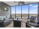 Relaxing screened patio with comfortable seating and a beautiful waterfront view at 123 N Dogwood St. # 107, Garden City Beach, SC 29576