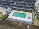 Aerial view of community pool, lounge chairs, and well-maintained grounds at 123 N Dogwood St. # 107, Garden City Beach, SC 29576