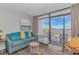 Cozy living room offering comfortable seating, an AC unit, and a balcony at 1501 Ocean Blvd. S # 607, Myrtle Beach, SC 29577