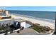 An aerial view of the beach featuring the ocean, resort, and parking lot at 1501 S Ocean Blvd. # 1203, Myrtle Beach, SC 29577