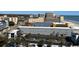 An aerial view of the beach featuring the ocean, resort, and parking lot at 1501 S Ocean Blvd. # 1203, Myrtle Beach, SC 29577