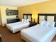 Charming bedroom featuring two beds, kitchenette, and modern decor at 1501 S Ocean Blvd. # 1203, Myrtle Beach, SC 29577
