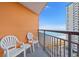 Balcony with ocean views, black metal railing, and two white plastic chairs at 1501 S Ocean Blvd. S # 1147, Myrtle Beach, SC 29577