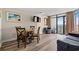 Cozy living room featuring modern decor, a dining area, and balcony access at 1501 S Ocean Blvd. S # 1147, Myrtle Beach, SC 29577