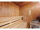 Wood sauna room with benches and a heater for relaxation at 1501 S Ocean Blvd. S # 1147, Myrtle Beach, SC 29577