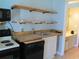 Kitchen with a view of the sink, oven, and open shelves at 1600 S Ocean Blvd. # 148, Myrtle Beach, SC 29577