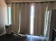 Kitchen area features curtains over the window, refrigerator, and vinyl flooring at 1600 S Ocean Blvd. # 148, Myrtle Beach, SC 29577