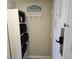 Entryway nook with a welcome sign, hanging rack, and storage shelves at 1605 South Ocean Blvd. # 1902, Myrtle Beach, SC 29577