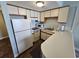 Kitchen with white appliances and ample counter space at 1605 South Ocean Blvd. # 1902, Myrtle Beach, SC 29577