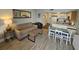 The living and dining area features a neutral palette, modern furniture, and a breakfast bar for easy entertaining and relaxed living at 1605 South Ocean Blvd. # 1902, Myrtle Beach, SC 29577
