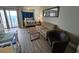 Bright living room with pull-out sofa, coffee table, and views of the Primary bedroom and ocean view at 1605 South Ocean Blvd. # 1902, Myrtle Beach, SC 29577