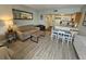Living room and dining area with kitchen view and sleeper sofa at 1605 South Ocean Blvd. # 1902, Myrtle Beach, SC 29577