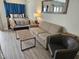Bright living room with pull-out sofa, coffee table, and views of the Primary bedroom at 1605 South Ocean Blvd. # 1902, Myrtle Beach, SC 29577