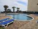 Large community swimming pool with lounge chairs and ocean views for relaxing and enjoying the sun at 1605 South Ocean Blvd. # 1902, Myrtle Beach, SC 29577