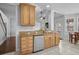 Kitchen area with wooden cabinets, granite countertops, and stainless steel dishwasher at 1909 Bingham Ct., Myrtle Beach, SC 29588