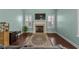 Living room showcasing a fireplace, large rug, and multiple windows providing natural light at 1909 Bingham Ct., Myrtle Beach, SC 29588