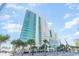 Stunning exterior view of a high-rise building in a coastal setting, showcasing its modern architectural design at 201 S Ocean Blvd. # 717, Myrtle Beach, SC 29577