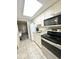 Functional kitchen with white cabinets and stainless steel appliances, offering a practical cooking space at 201 S Ocean Blvd. # 717, Myrtle Beach, SC 29577