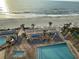View of the pool deck with beach access and lounge chairs at 201 S Ocean Blvd. # 717, Myrtle Beach, SC 29577