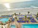 Aerial view of the pool deck with lounge chairs and direct beach access at 201 S Ocean Blvd. # 717, Myrtle Beach, SC 29577