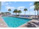 Large outdoor pool with lounge chairs and palm trees, close to the beach at 201 S Ocean Blvd. # 717, Myrtle Beach, SC 29577