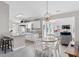 Bright kitchen with white cabinets, breakfast bar, open dining area and view of living room at 2029 Hawksmoor Dr., Conway, SC 29526