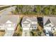 Aerial view of the home showcasing its location, landscaping, and proximity to a pond and surrounding trees at 204 Juniata Loop, Little River, SC 29566