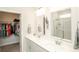 Bright bathroom featuring double sinks, walk-in closet and glass shower at 204 Juniata Loop, Little River, SC 29566