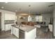 Open kitchen with a center island, modern appliances, and seamless flow into the living and dining areas at 204 Juniata Loop, Little River, SC 29566