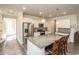 Modern kitchen featuring stainless steel appliances, granite counters, white cabinets, and an island with seating at 204 Juniata Loop, Little River, SC 29566