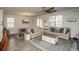 Bright living room with comfortable seating, hardwood floors, and an adjacent dining area at 204 Juniata Loop, Little River, SC 29566