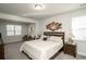 Comfortable main bedroom featuring a large window, neutral colors, and plush carpeting at 204 Juniata Loop, Little River, SC 29566