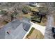 Aerial view of home with backyard, driveway, mature trees, and surrounding landscape at 213 S Farr Ave., Andrews, SC 29510