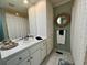 Bathroom with vanity, shower with curtain, and a decorative mirror at 213 S Farr Ave., Andrews, SC 29510