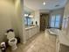 Spacious bathroom featuring double vanity, walk-in shower, and separate soaking tub at 213 S Farr Ave., Andrews, SC 29510