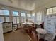 Dining room with a round table, seating six, and large windows with shutters at 213 S Farr Ave., Andrews, SC 29510