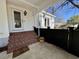 Charming front porch with brick stairs, flower pots, and inviting entrance at 213 S Farr Ave., Andrews, SC 29510