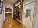 Hallway with built-in bookcase with books, leading to the kitchen and bathroom at 213 S Farr Ave., Andrews, SC 29510