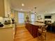 Well-appointed kitchen with granite countertops, island with seating, and stainless steel appliances at 213 S Farr Ave., Andrews, SC 29510