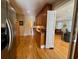 Open kitchen concept with hardwood floors and stainless steel refrigerator at 213 S Farr Ave., Andrews, SC 29510