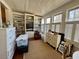 Bright living room with built-in bookshelves and large windows with shutters at 213 S Farr Ave., Andrews, SC 29510
