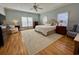 Cozy main bedroom with neutral tones, hardwood floors, and ample natural light at 213 S Farr Ave., Andrews, SC 29510