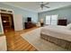 Serene main bedroom with hardwood floors, neutral colors, and an en-suite bathroom at 213 S Farr Ave., Andrews, SC 29510