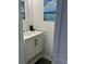 Bathroom featuring a modern vanity with granite countertops and chrome faucet at 217 N Myrtle St. # 1, Myrtle Beach, SC 29577