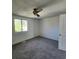 Bright bedroom with a ceiling fan and a large window, offering natural light and comfort at 217 N Myrtle St. # 1, Myrtle Beach, SC 29577