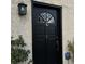 Close up of the elegant black front door with glass detail, house number one at 217 N Myrtle St. # 1, Myrtle Beach, SC 29577
