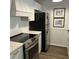 Well-lit kitchen featuring stainless steel appliances, shaker cabinets and stone counter tops at 217 N Myrtle St. # 1, Myrtle Beach, SC 29577