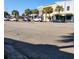 Street view featuring retail buildings with palm trees on a sunny day and cars parked along the roadside at 217 N Myrtle St. # 1, Myrtle Beach, SC 29577